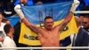 Oleksandr Usyk celebrates winning a fight in Wroclaw, Poland, in August 2023.