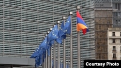Belgium - EU and Armenia-flags fly outside the EU headquarters in Brussels.