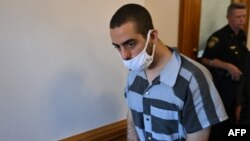 Hadi Matar, the man accused in the attempted murder of British author Salman Rushdie, leaves court after a procedural hearing at Chautauqua County Courthouse in Mayville, New York, on August 18.