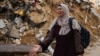 O femeie reacționează în urma loviturilor israeliene asupra Rafah, în sudul Fâșiei Gaza. 24 octombrie 2023. (AFP)