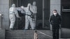 CHINA -- Medical staff members carry a patient into the Jinyintan hospital, where patients infected by a mysterious SARS-like virus are being treated, in Wuhan in China's central Hubei province, January 18, 2020
