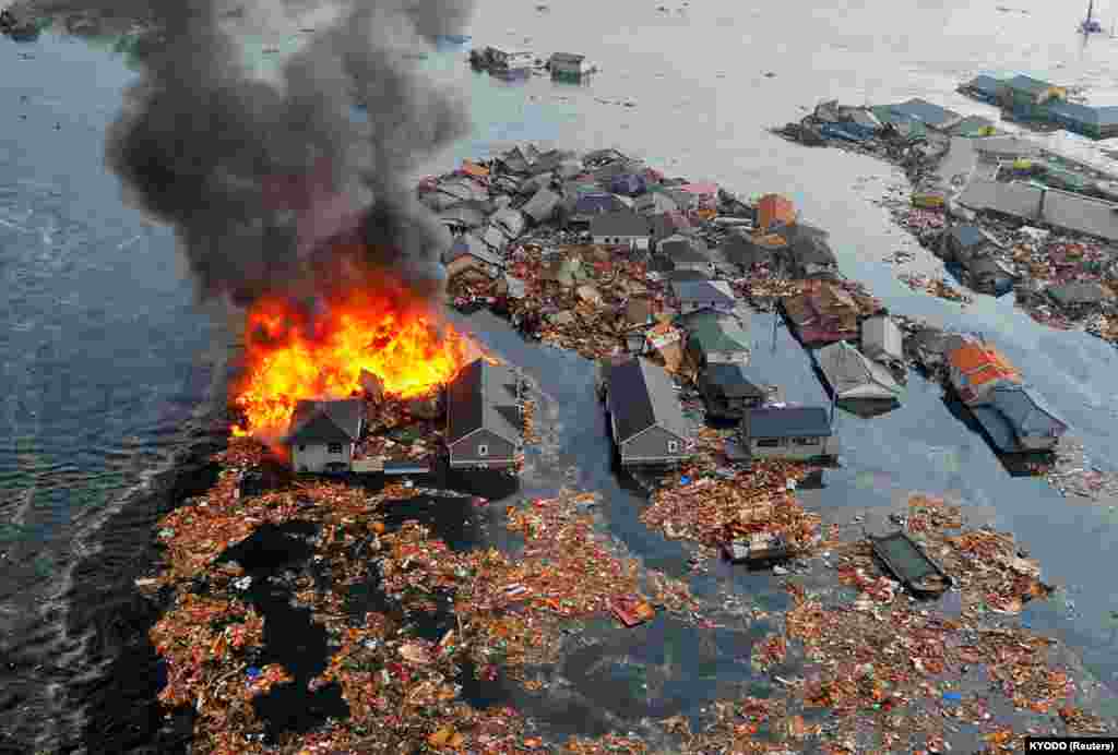 Casele au fost efectiv măturate de uriașul tsunami provocat de puternicul cutremur care a zguduit orașul Natori din nord-estul Japoniei, 11 martie 2011.