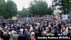 Georgian opposition protesters rally against President Mikheil Saakashvili in Tbilisi on May 25.