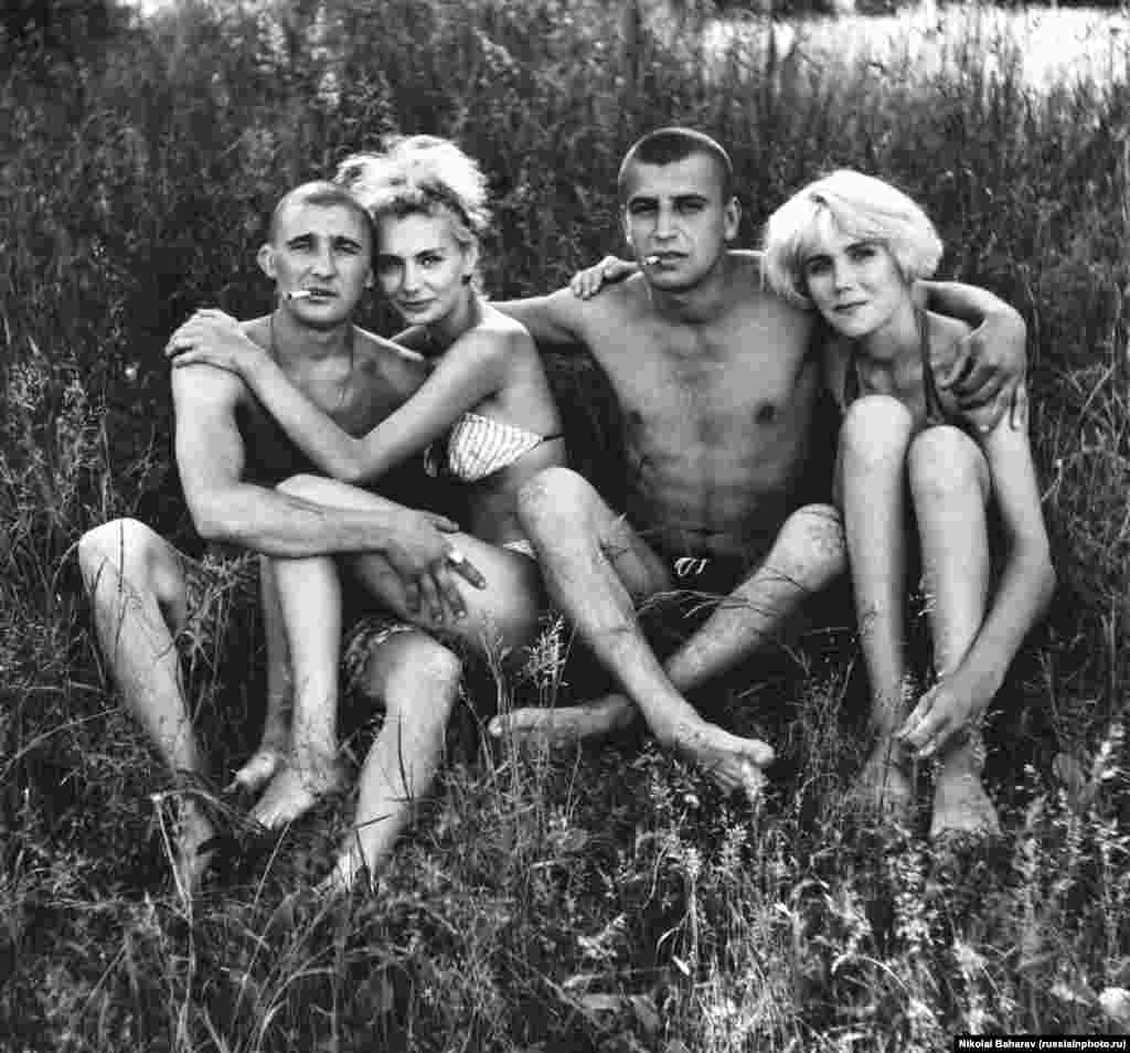 Young Russians relaxing in the sun. The photographer, Nikolai Baharev, grew up an orphan and worked as a locksmith, photographing people in his spare time. Today the 69-year-old exhibits in Europe's most prestigious galleries. 