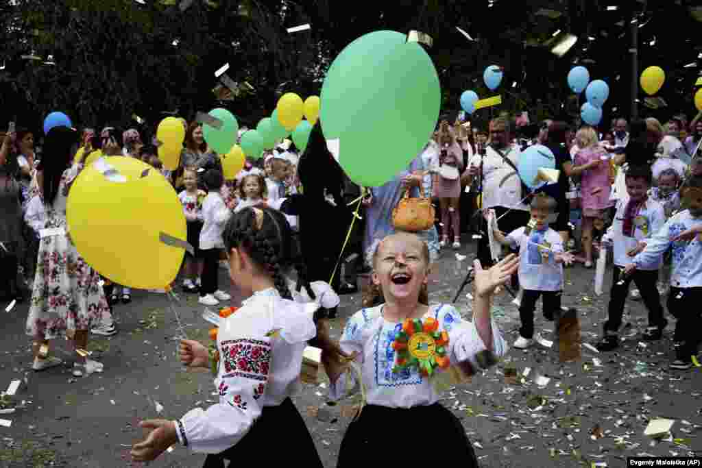 Ukrainian children -- many wearing the traditional "vyshyvanka" embroidered shirts -- celebrate their first day of school in Zaporizhzhya on September 1. 