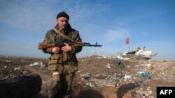 A pro-Russian separatist near the Ukrainian village of Frunze in Luhansk Oblast