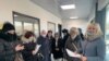 Активистка Санавар Закирова (справа) и группа недовольных решениями судов в здании представительства Европейского союза. Нур-Султан, 16 марта 2021 года.