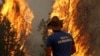 Armenia - A Ministry for Emergency Situations worker battles a wildfire in the Vayots Dzor province, 11Aug2017.