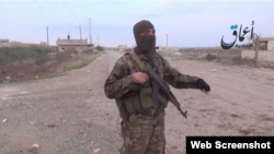 A screen shot from a video that shows an IS militant claiming to have re-captured the Halnaj-Kobani road from Kurds in the battle for the Syrian town of Kobani