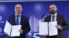 Armenia - Economy Minister Gevorg Papoyan (right) and Lydian Armenia CEO Hayk Aloyan sign a share transfer agreement in Yerevan, December 27, 2024.