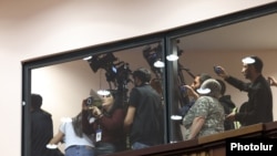 Armenia - Journalists protest against a senior lawmaker during a session of the Armenian parliament, Yerevan, March 26, 2025.