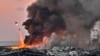 LEBANON - A helicopter puts out a fire at the scene of an explosion at the port of Lebanon's capital Beirut on August 4, 2020.