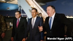 U.S. Secretary of State Mike Pompeo (right) paid an unexpected visit to Baghdad last week.