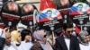West Steps Up Pressure On Russia Over Syria, Assad Allies Threaten To Respond To 'Aggression'