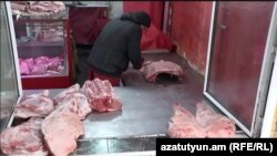 Armenia - A meat stall at a food market in Yerevan, December 13, 2024.