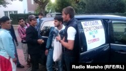 Austria --Chechens from Austria brought food in refugee camp, Vienn, 14 September 2015