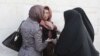 Women in the country of more than 80 million people are required to cover their heads, necks, and hair, a law enforced by the country's morality police. (file photo)