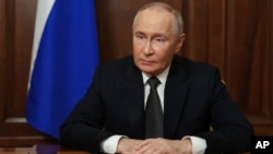 Russian President Vladimir Putin makes a video statement to the nation on November 21.