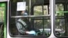 Armenia -- A masked commuter rides a bus in Yerevan, May 18, 2020.