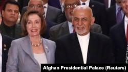 Afghan President Ashraf Ghani (right) and U.S. House Speaker Nancy Pelosi pose for a photo in Kabul on October 20.