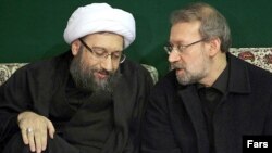 علی لاریجانی (راست) رییس مجلس شورای اسلامی همراه با برادرش صادق لاریجانی.