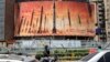 Un billboard cu rachete balistice iraniene, în centrul Teheranului, 15 aprilie. Iranul a îndemnat Israelul să nu riposteze militar la atacul său din weekend, pe care Teheranul l-a prezentat ca fiind un răspuns la atacul mortal asupra clădirii consulatului său din Siria.