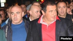 Armenia - Businessman Gagik Tsarukian (R) and his chief bodyguard Eduard Babayan (L) take part in an anti-government demonstration in Yerevan, 24 October 2014.