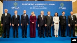 G7 foreign ministers pose for a group photo in Rome on November 26.