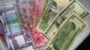 Çeşme: Hökümet dollaryň resmi kursuny ýokarlandyrmagy planlaşdyrýar