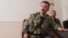 Російський полковник Ігор Гіркін (Стрєлков). Позаду нього інший росіянин – Олександр Бородай, один із ватажків угруповання «ДНР», що визнане в Україні терористичним. Окупований Донецьк, 10 липня 2014 року