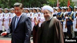 استقبال رئیس‌جمهور چین از حسن روحانی، در سفر سال گذشته روحانی به شانگهای
