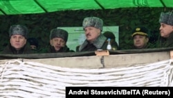 Belarusian leader Alyaksandr Lukashenka (center) watches joint military exercises held with Russia in the Mogilev region of Belarus on February 17.
