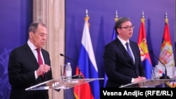 Russian Foreign Minister Sergei Lavrov (left) and Serbian President Aleksandar Vucic speak to reporters after meeting on June 18 in Belgrade.
