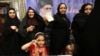 Iranian women cast their ballots for the presidential election at a polling station in Tehran on May 19.