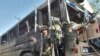 A bus that hit a roadside bomb in Kabul in May