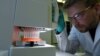 Employee Philipp Hoffmann, of German biopharmaceutical company CureVac, demonstrates research workflow on a vaccine for the coronavirus (COVID-19) disease at a laboratory in Tuebingen