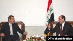حسن دانایی فر (سمت چپ) همراه نوری مالکی، نخست وزیر عراق